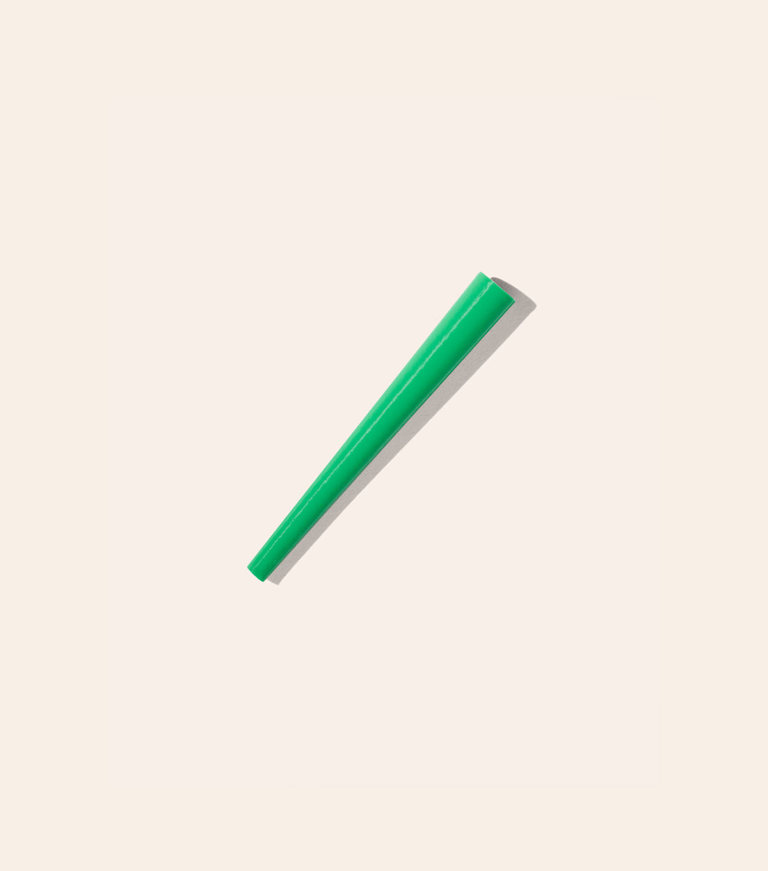 The Kelly Green Joint Cone, a cone shaped plastic tool that helps you roll the perfect joint