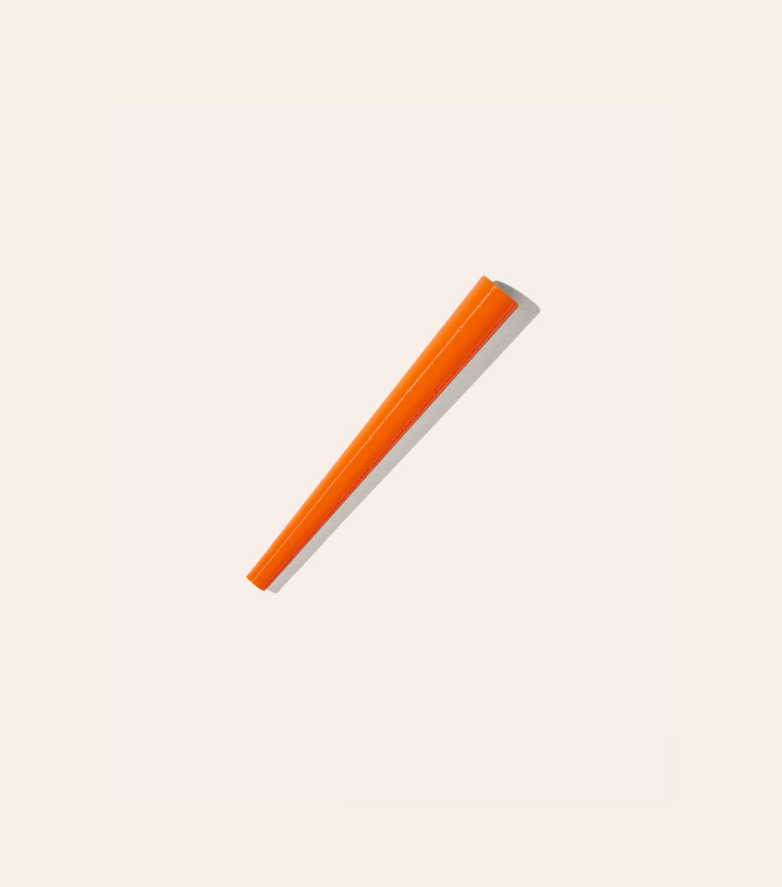 The Safety Orange Joint Cone, a cone shaped plastic tool that helps you roll the perfect joint