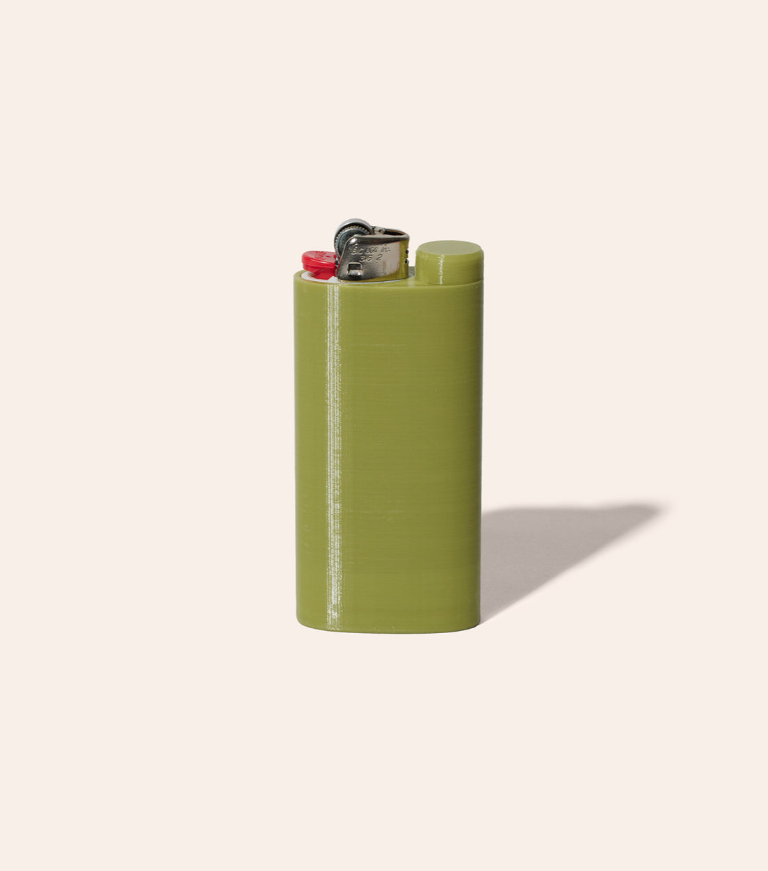 The Green Jointlocker 1.0 with BIC lighter inserted into lighter case, and cap twisted onto protective joint holder