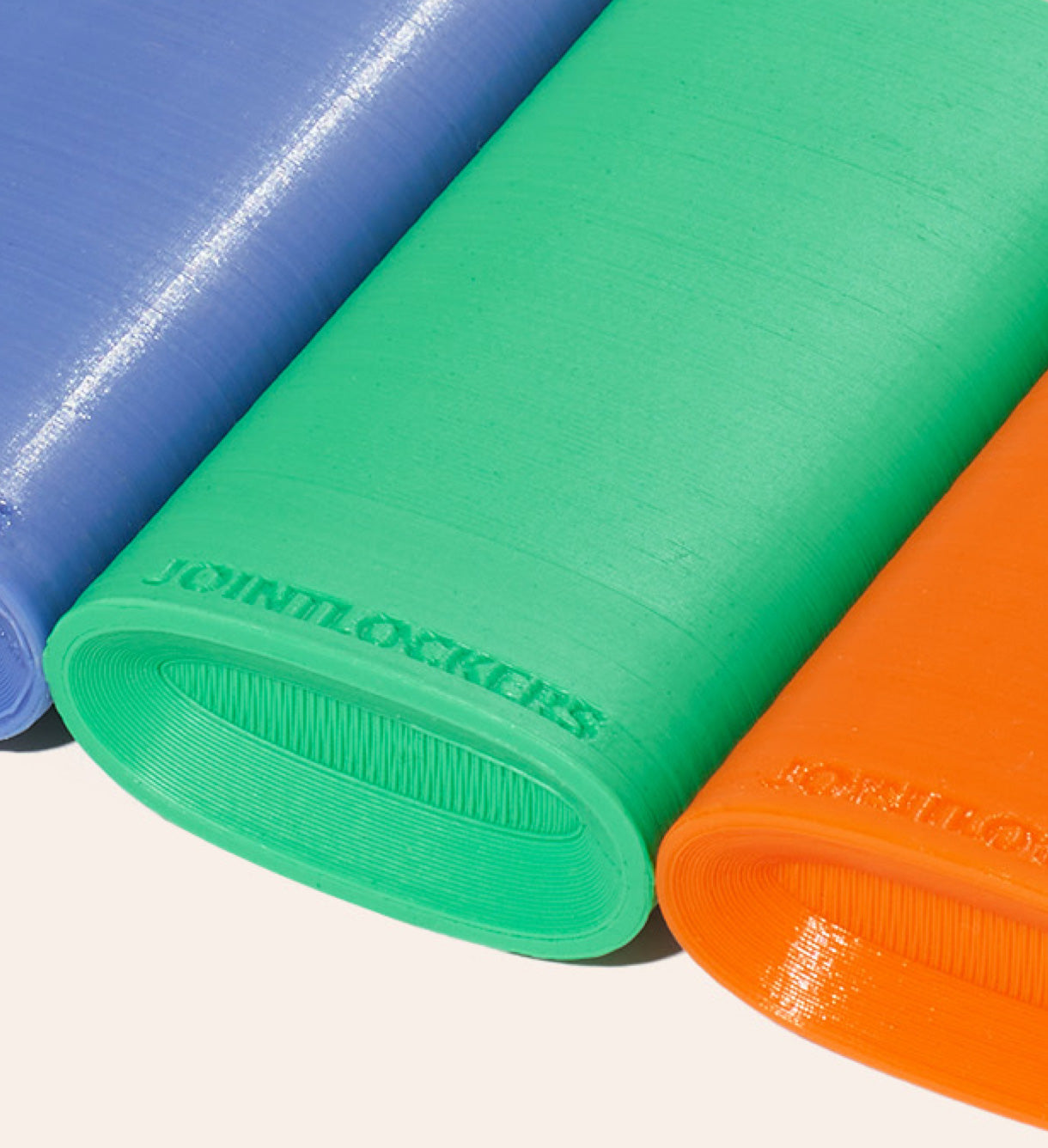The scooped bottom of the Periwinkle, Kelly Green, and Safety Orange Jointlocker 2.0
