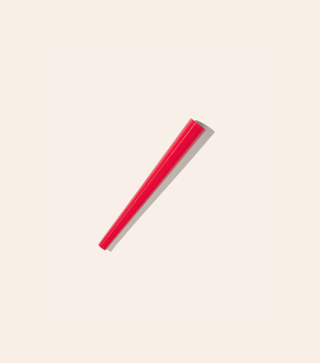 The Strawberry Red Joint Cone, a cone shaped plastic tool that helps you roll the perfect joint 