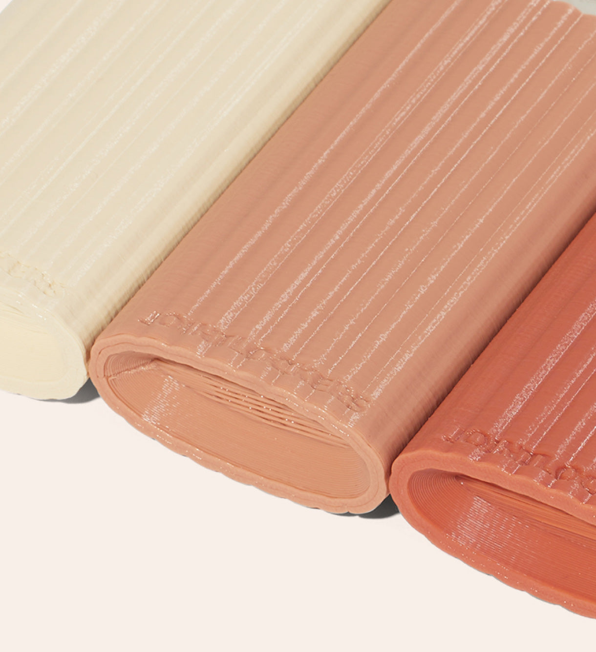 The scooped bottom of The Corduroy Jointlocker 2.0 in Cosmic Latte, Clay, and Terracotta