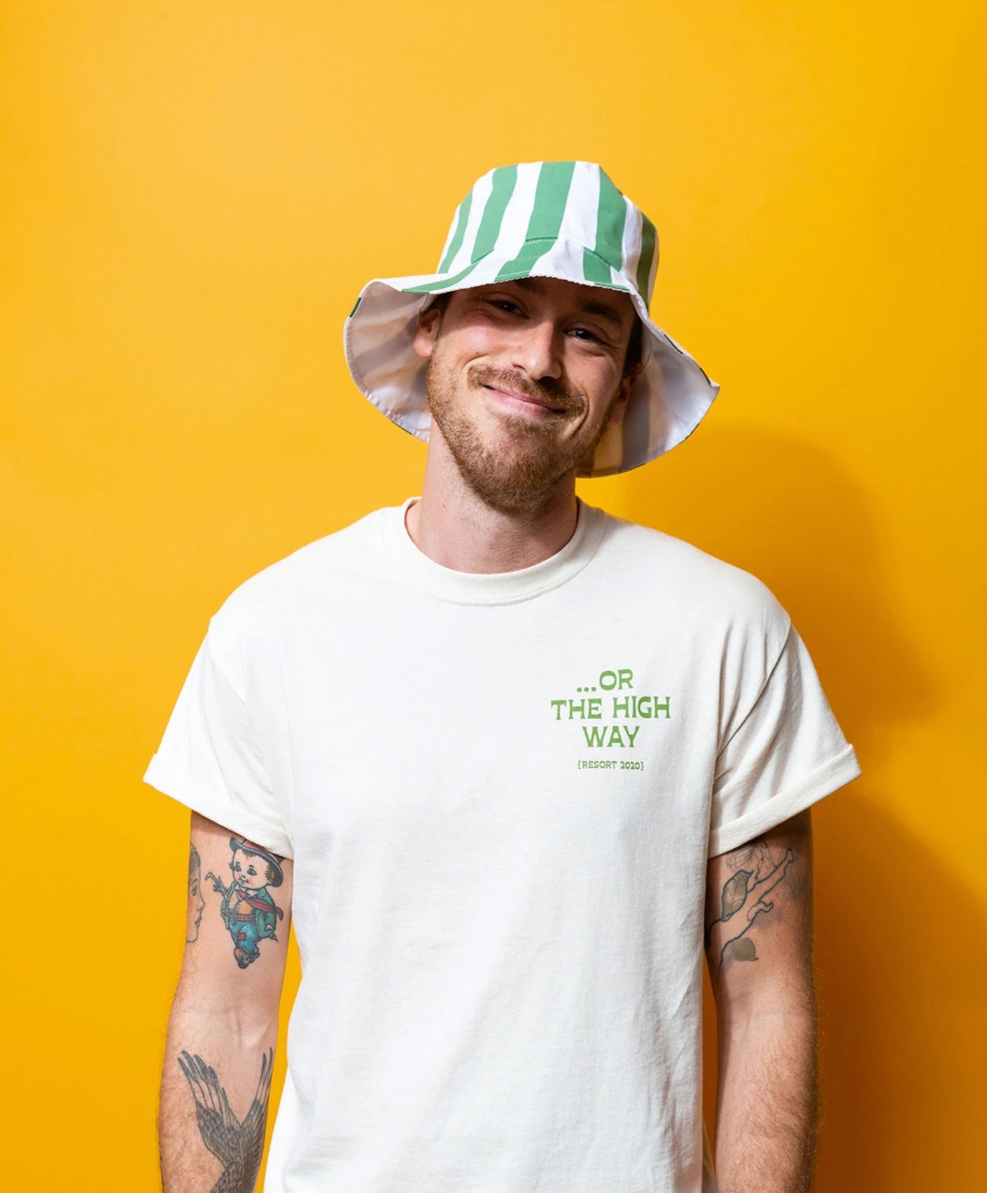 The Tourist Tee being worn by a stoner in a bucket hat