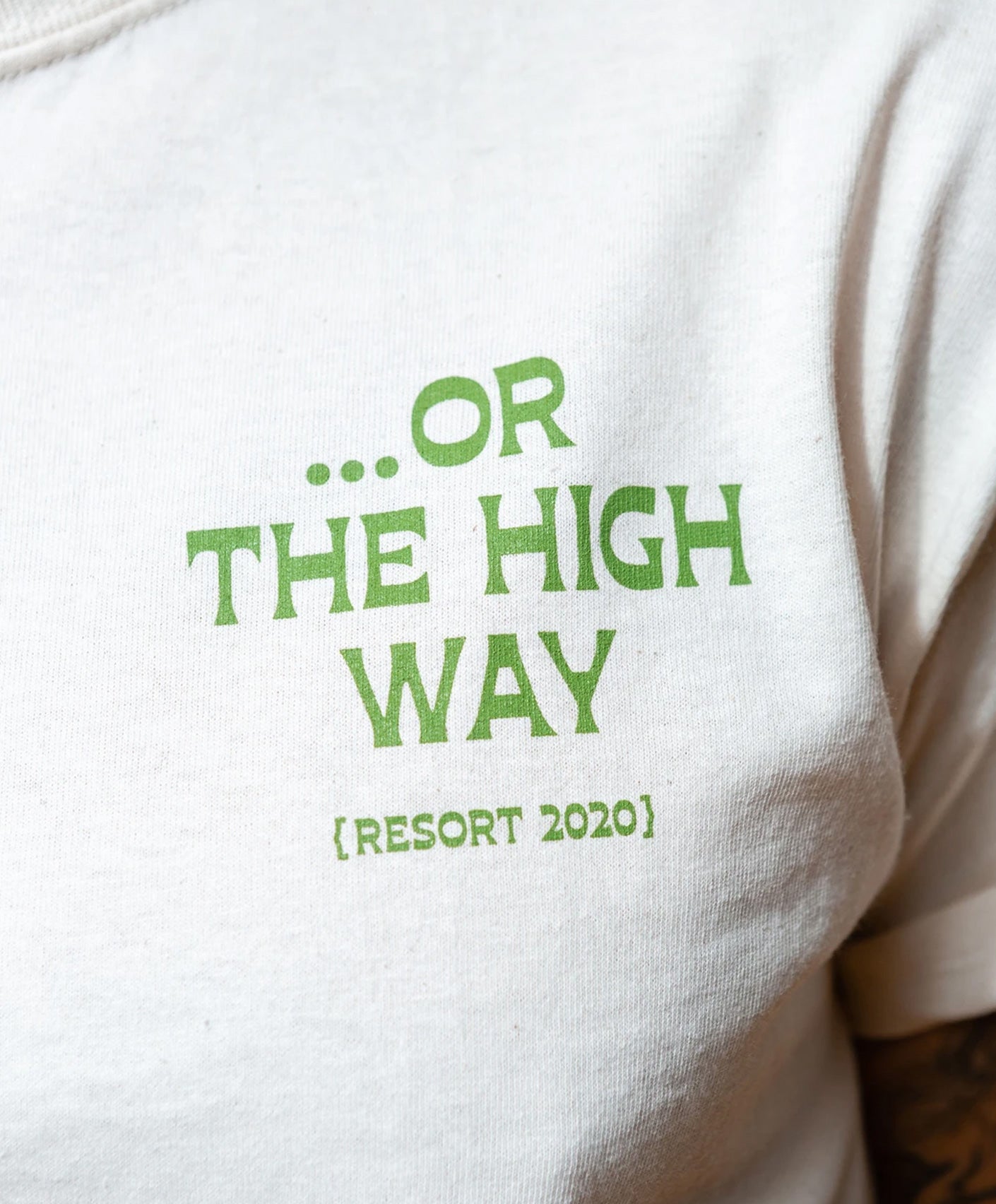 The Tourist Tee shirt which reads "...OR THE HIGH WAY"